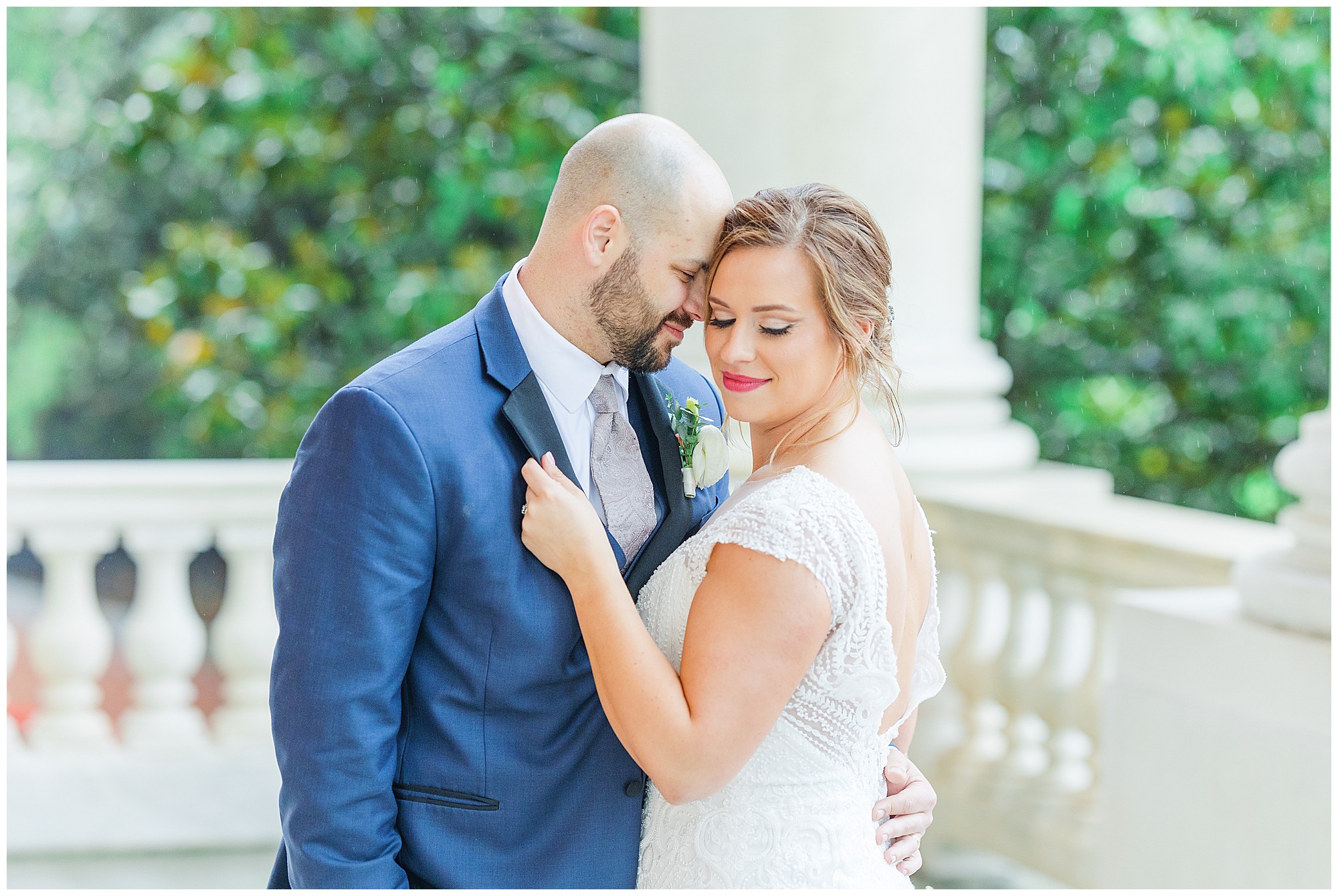 bride and groom at rainy graduate annapolis wedding by chesapeake charm photography